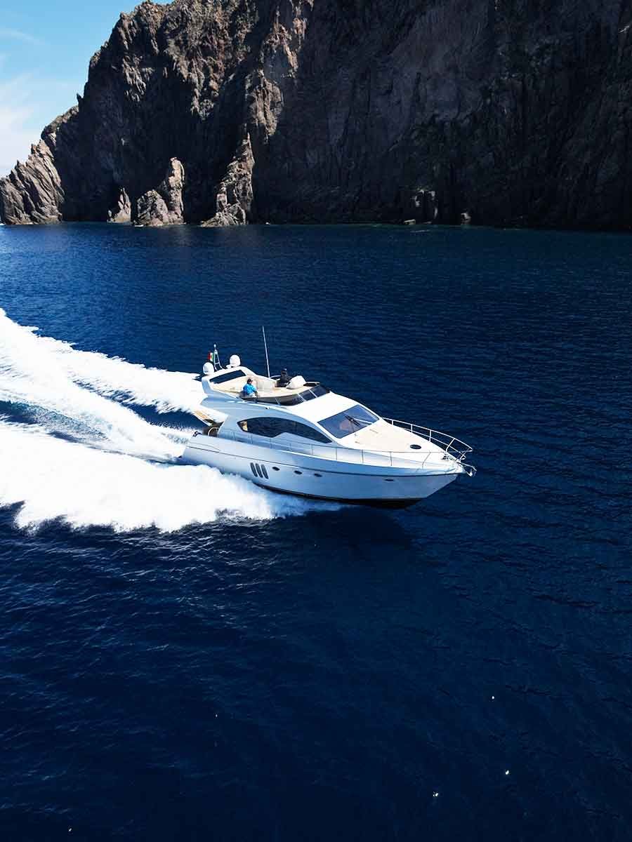 Luxury VIP yacht rental cruising near The Arch in Cabo San Lucas
