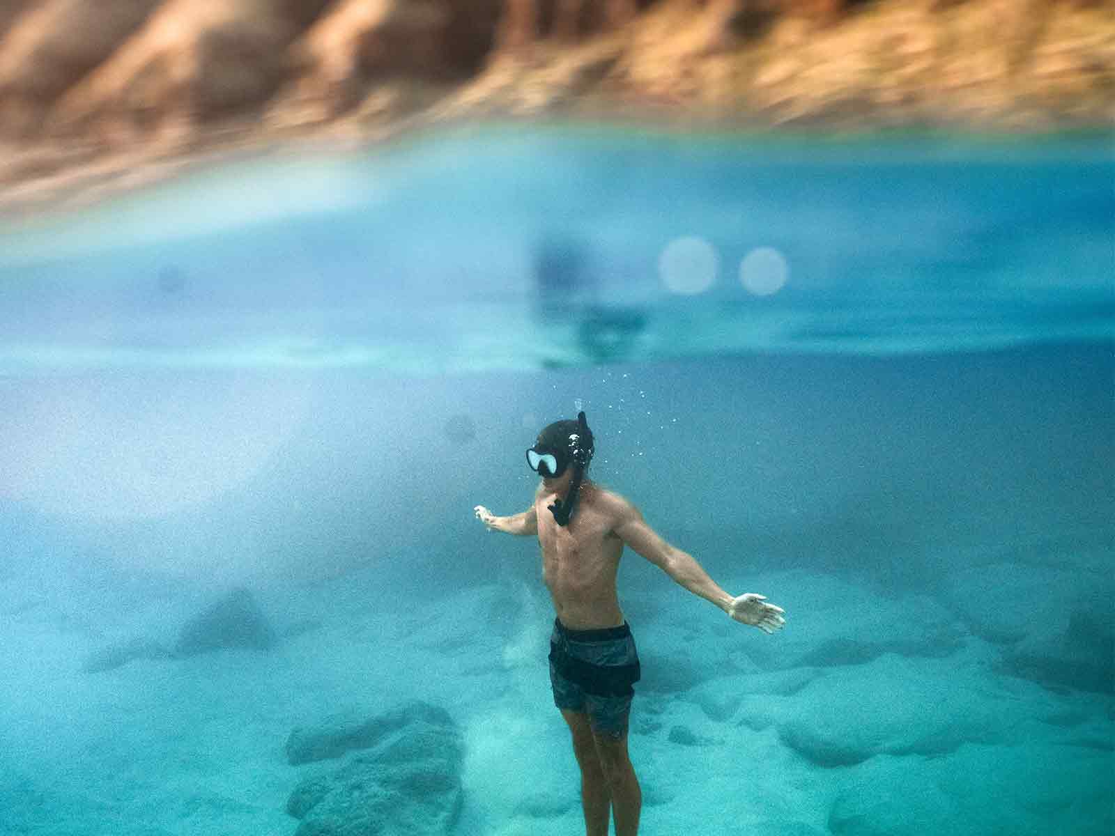 Private Cabo snorkeling tour boat at Pelican Rock near The Arch